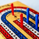 Why do cribbage boards have 3 tracks